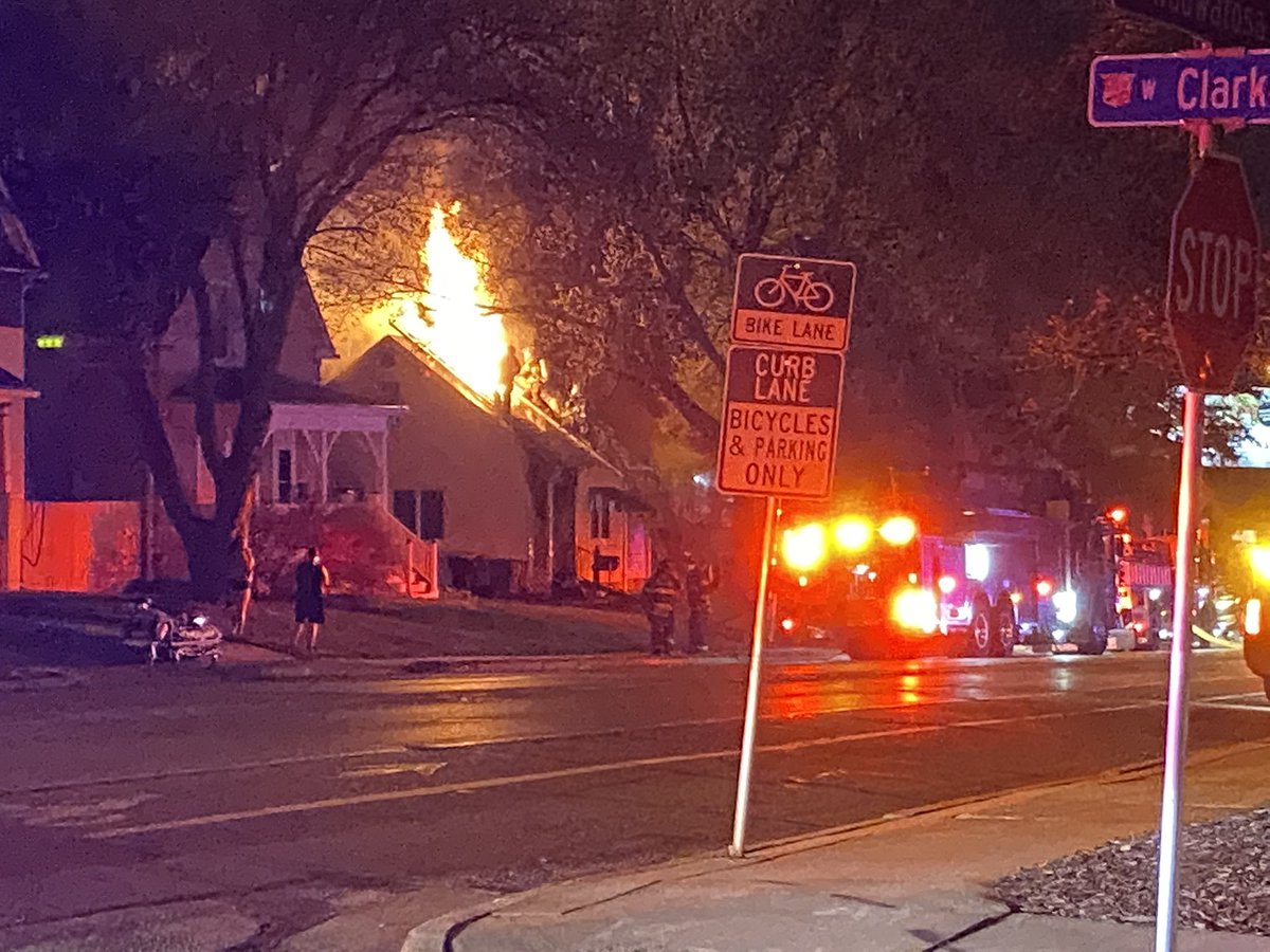 Tosa Fire on scene of a fire at the intersection of Wauwatosa Ave and Clarke St. flames showing through the roof on arrival. Sounded like it started as a porch fire.