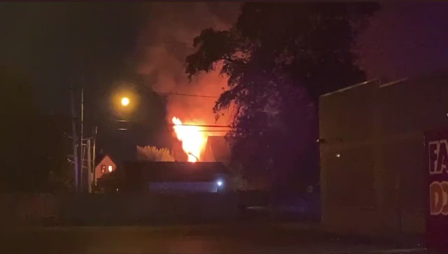 The scene of a fire & reported shooting near 22nd and Center. Flames are visible from this home on 22nd.  Milwaukee Fire Department are on the scene of a two-alarm fire